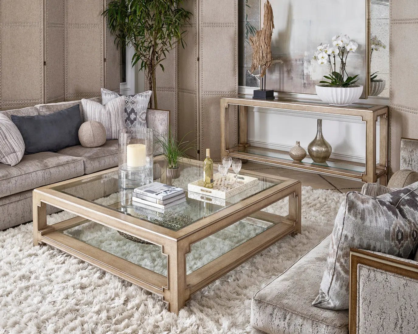 a luxury looking living room filled with furniture and a large mirror
