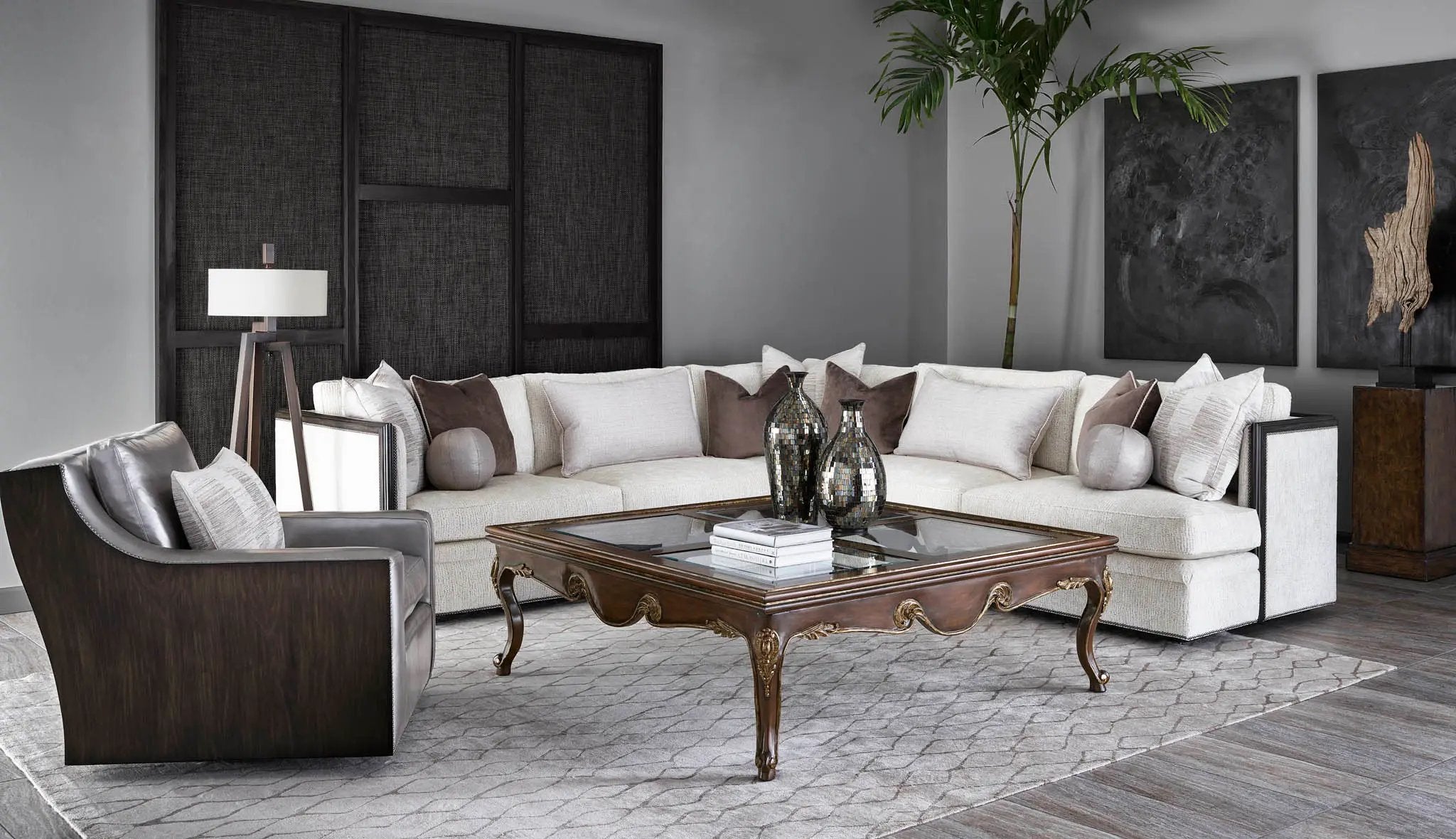 a living room filled with furniture and a plant