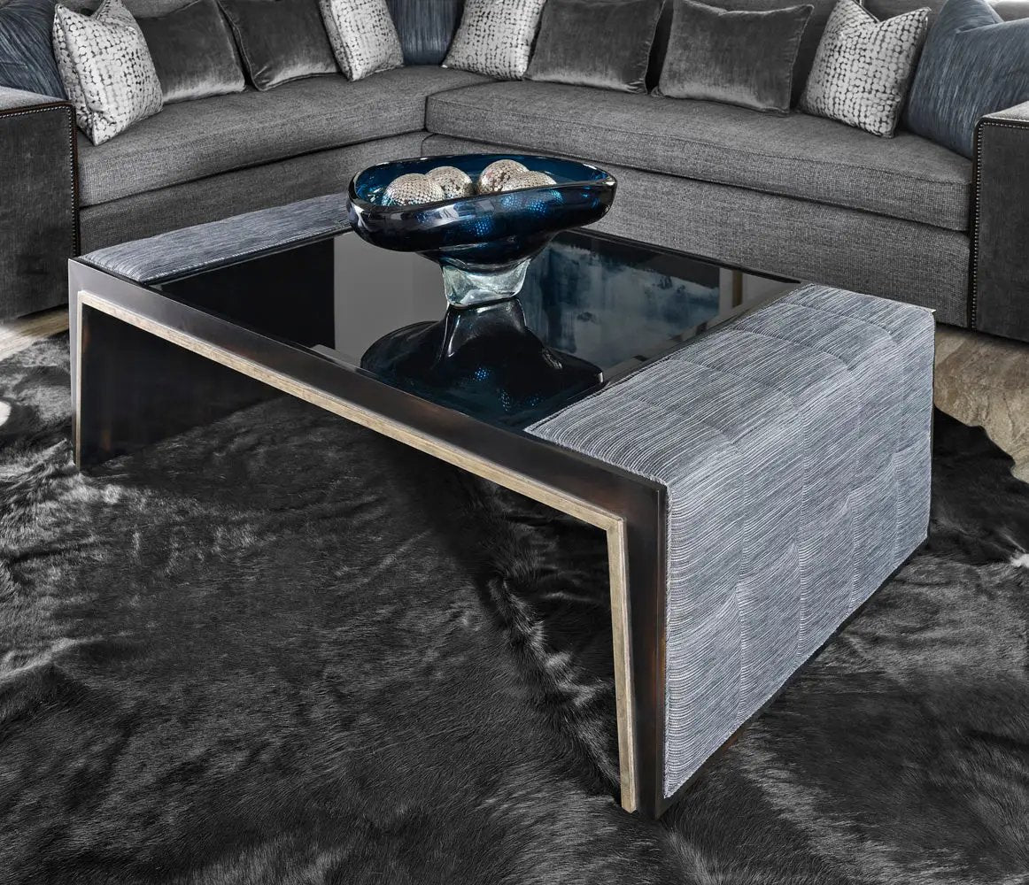 a couch and a coctail table in a room