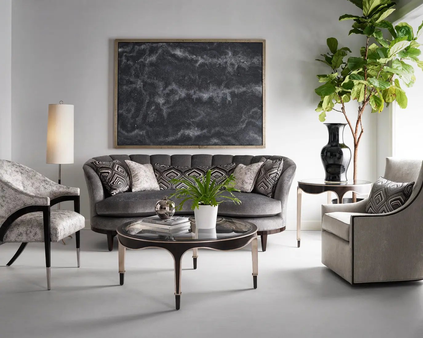 a living room filled with furniture and a painting on the wall