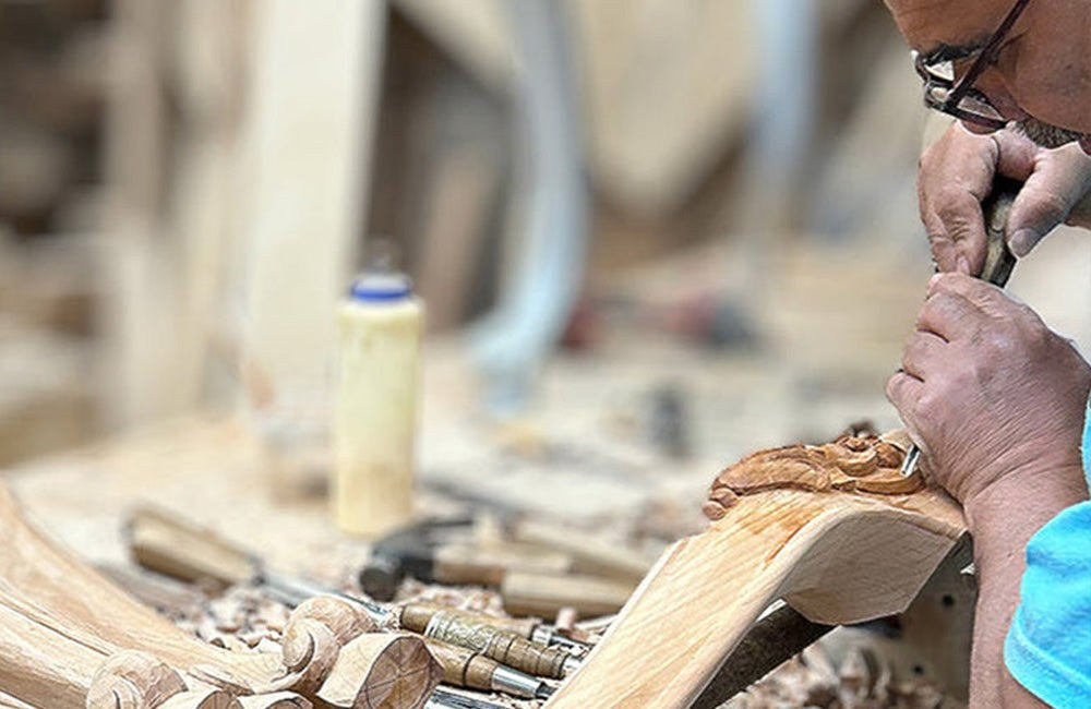 Carving a chair arm by hand